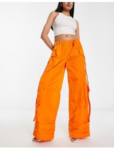 Pantalones naranja luminoso extragrandes estilo paracaidista de nailon de Annorlunda