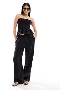 Pantalones playeros negros con cintura estrecha de Iisla & Bird (parte de un conjunto)