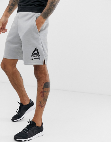 pantalones reebok gris