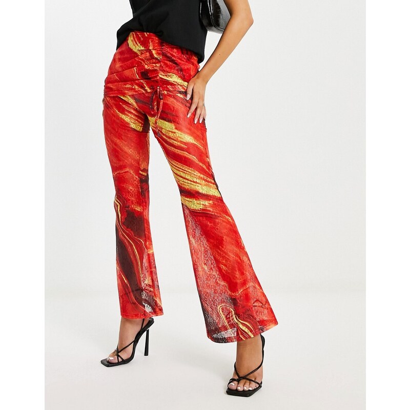 Pantalones multicolores con estampado de lava y detalle superior de falda de encaje de Annorlunda-Naranja