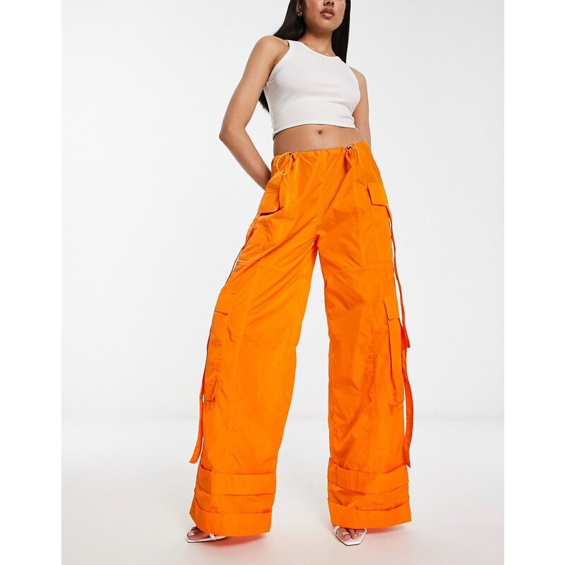 Pantalones naranja luminoso extragrandes estilo paracaidista de nailon de Annorlunda