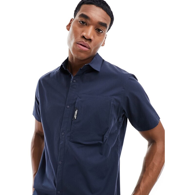 Camisa azul marino de manga corta con detalle de bolsillo de Marshall Artist